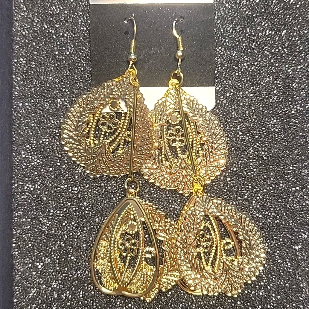 Gold dangle earrings.